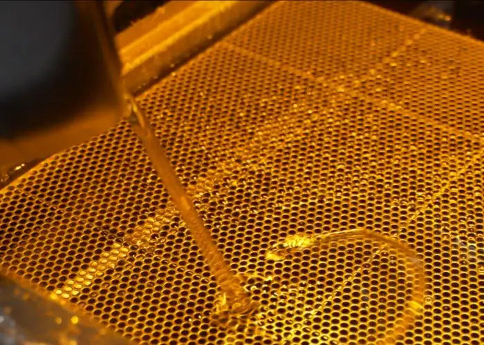 Building a plastic prototype layer by layer with 3D printing.