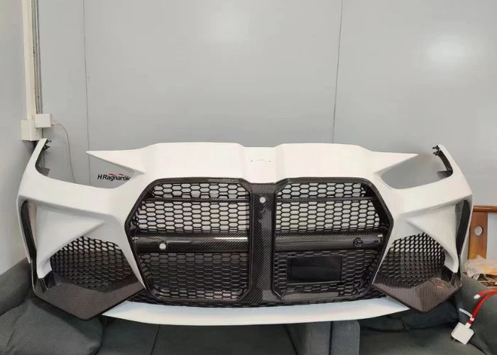 Large plastic grille prototype for automotive design validation.