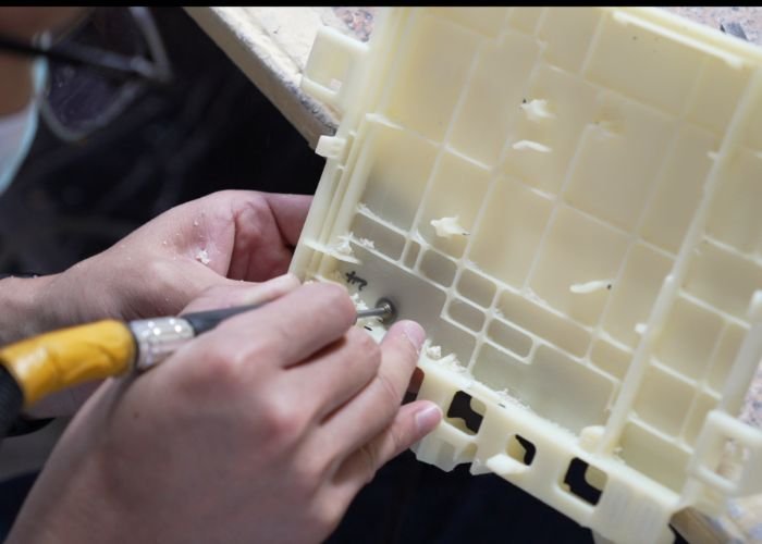 complete prototype services,Manual deburring of plastic prototype edges after machining.
