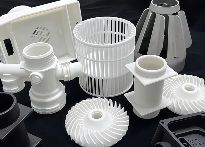 White plastic ABS components used in housings, fans, ducts, and functional product assemblies