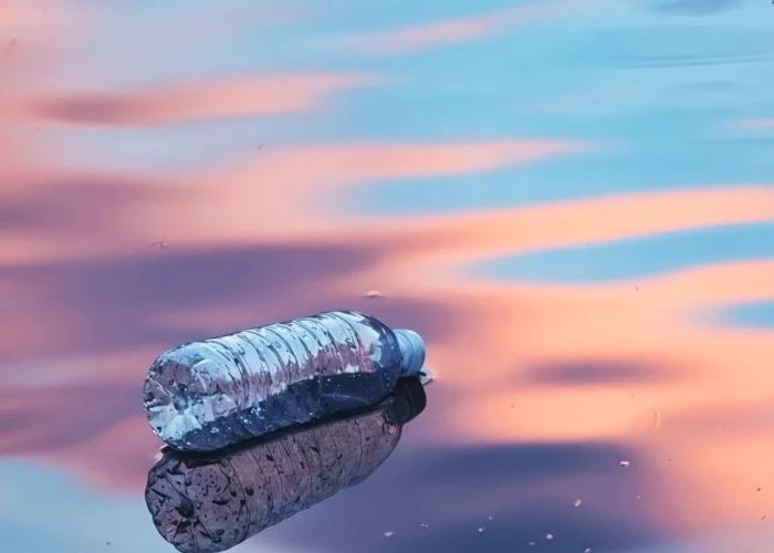 abandoned empty plastic bottles floating on sea water surface, plastic waste contaminating ocean ecosystem