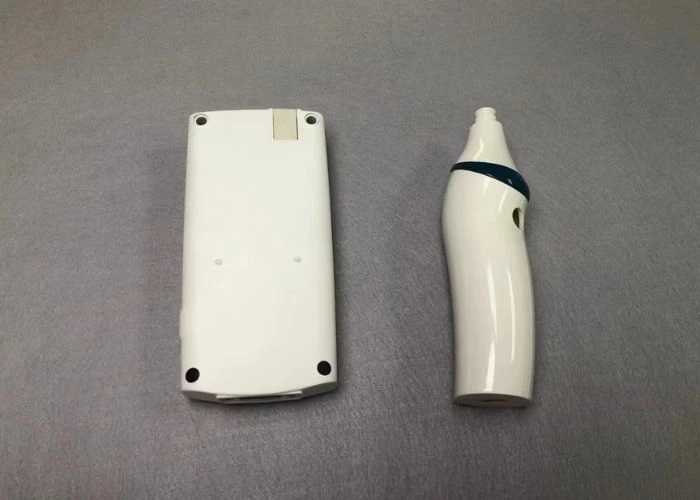 Painted plastic prototype parts with gloss and matte finishes.