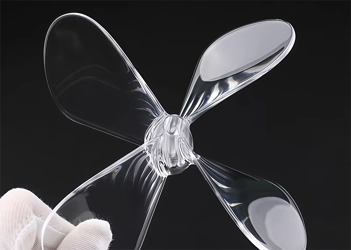Transparent polycarbonate propeller showing the material's clarity and impact resistance
