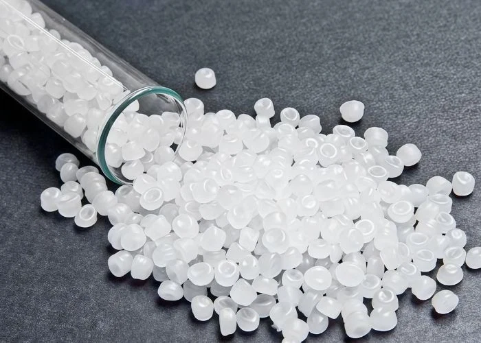 POM polyoxymethylene engineering plastic raw material pellets, close-up of milky white particles, real shot of polymer plastic raw materials
