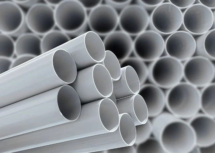 A large number of PVC industrial plastic pipes neatly stacked, display of finished plastic pipe products and pipeline raw materials
